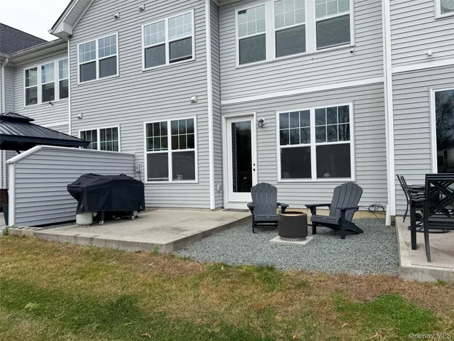 a aerial view of a house with a yard