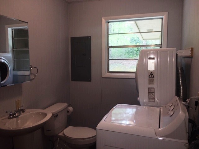 24 Hamby Road Blue Ridge, GA 30513 - Photo 14 of 14 a bathroom with a toilet sink and mirror
