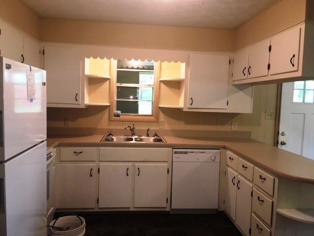 24 Hamby Road Blue Ridge, GA 30513 - Photo 2 of 14 a kitchen with cabinets appliances a sink and a window