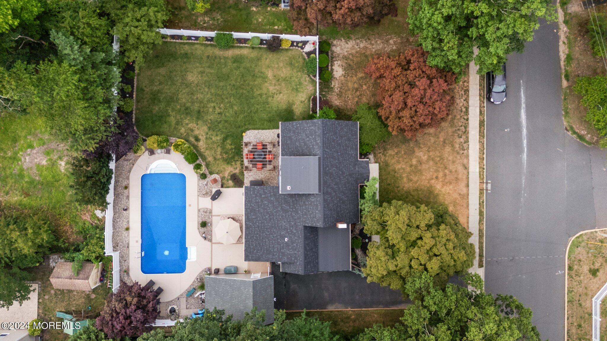 202 Highwood Road Oakhurst, NJ 07755 - Photo 42 of 48 an aerial view of a house with a yard and lake view