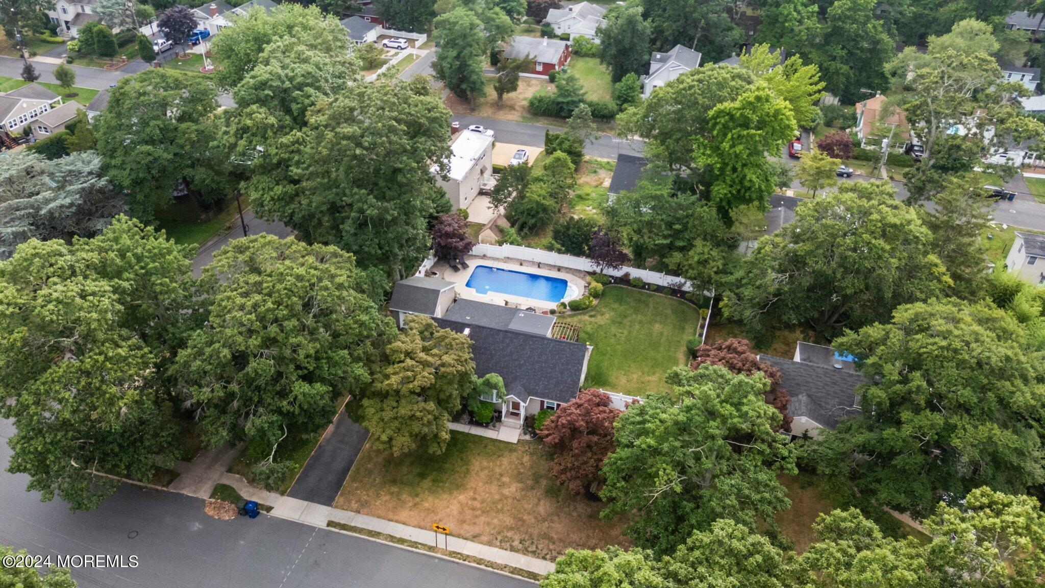 202 Highwood Road Oakhurst, NJ 07755 - Photo 43 of 48 an aerial view of a house with a yard