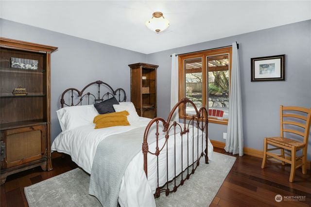 a bathroom with a double vanity sink mirror and toilet