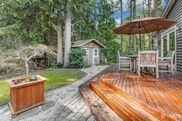 a backyard of house with outdoor seating