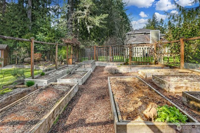 swimming pool view with a seating space