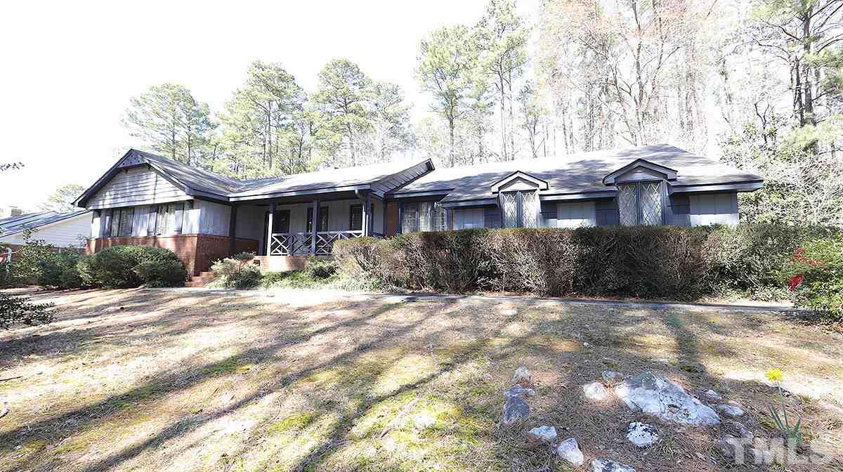 210 Queensferry Road Cary, NC 27511 - Photo 1 of 14 a front view of a house with yard and green space