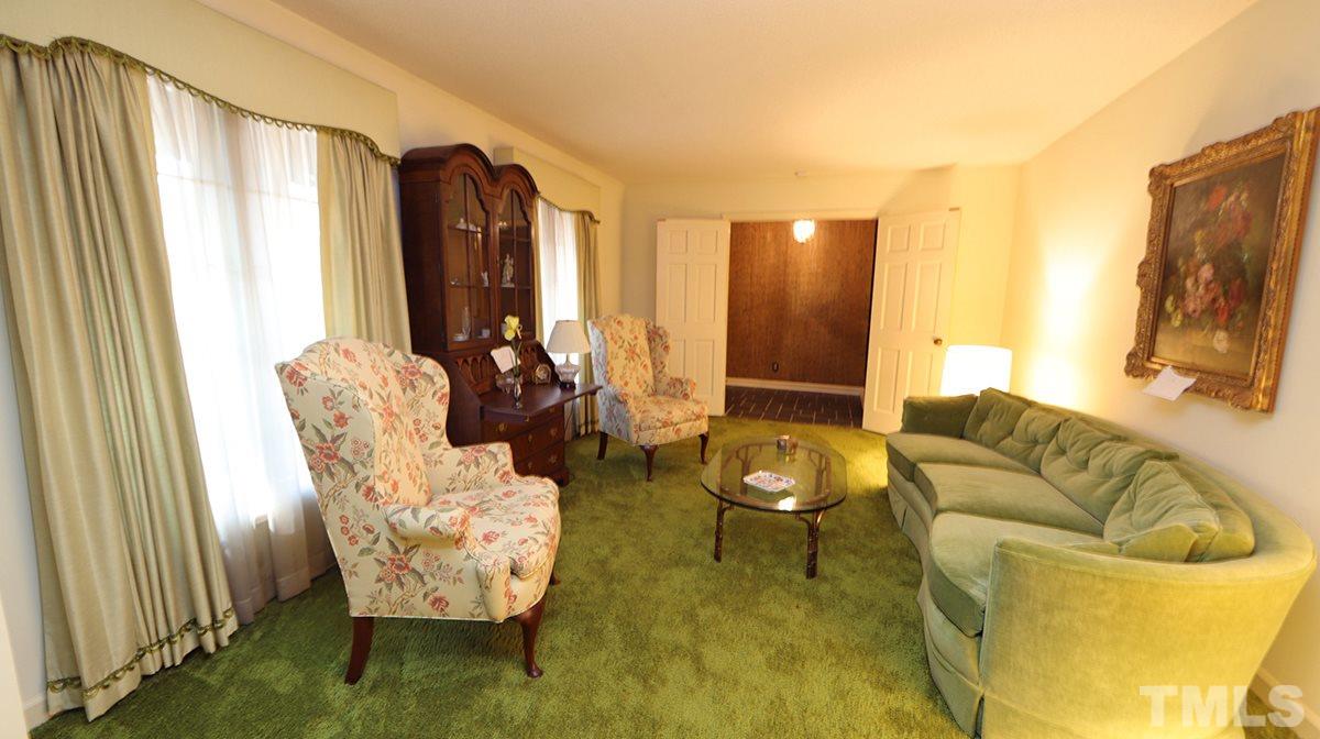 210 Queensferry Road Cary, NC 27511 - Photo 2 of 14 a living room with furniture and a flat screen tv