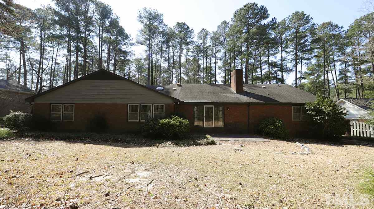 210 Queensferry Road Cary, NC 27511 - Photo 12 of 14 a front view of a house with a yard covered in snow