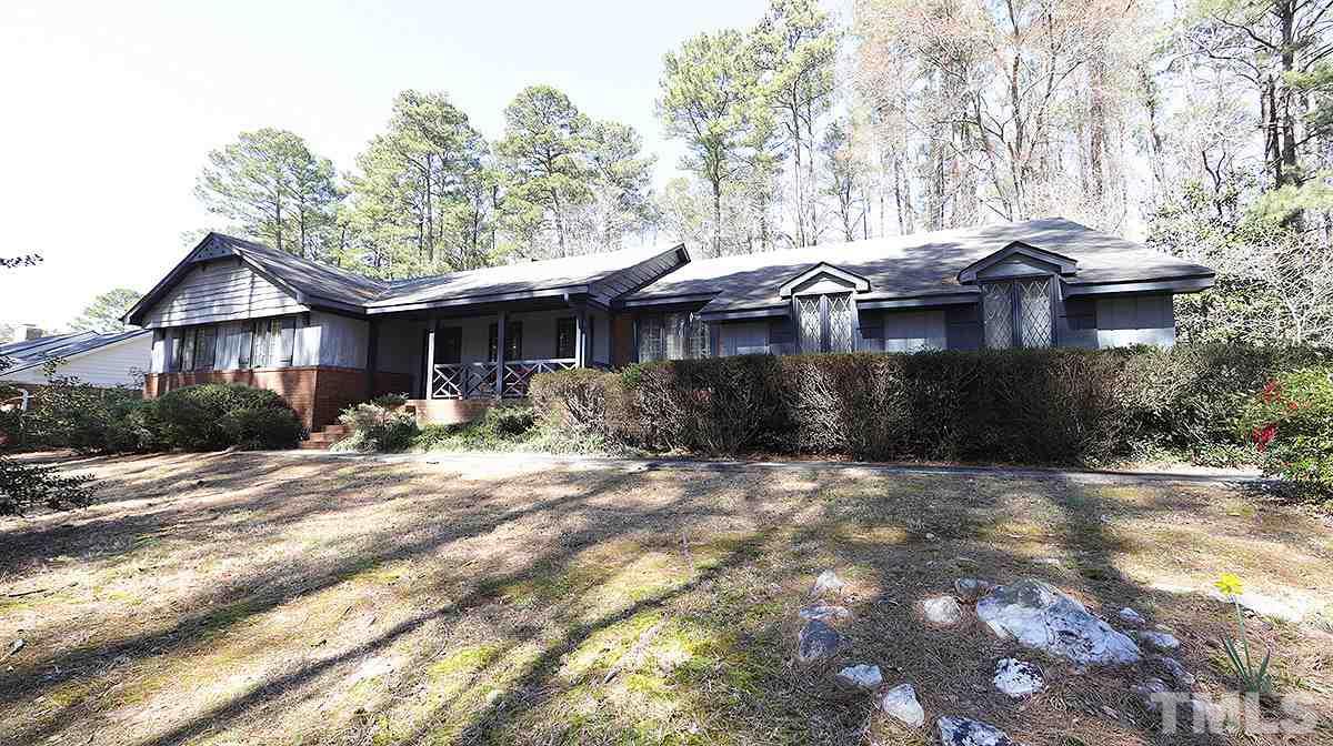 210 Queensferry Road Cary, NC 27511 - Photo 13 of 14 a front view of a house with yard and trees around