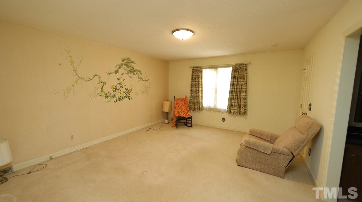 210 Queensferry Road Cary, NC 27511 - Photo 9 of 14 a living room with a couch and a window