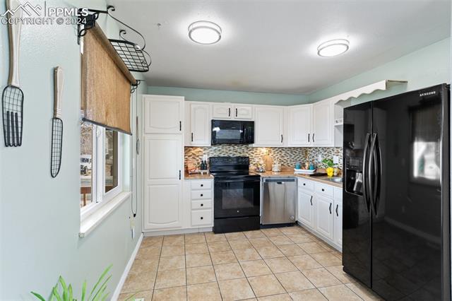 2111 Monterey Road Colorado Springs, CO 80910 - Photo 11 of 42 Spacious kitchen with pantry cabinets
