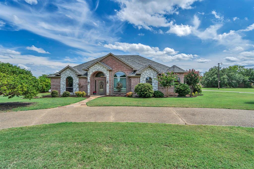 50 Buckingham Lane Allen, TX 75002 - Photo 3 of 39 French provincial home featuring brick siding, stone siding, and a front lawn