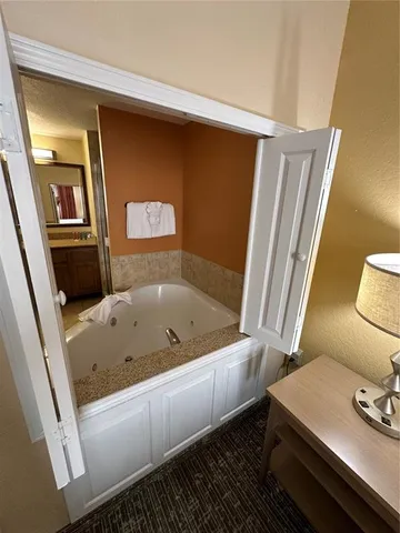 a bathroom with a tub and sink