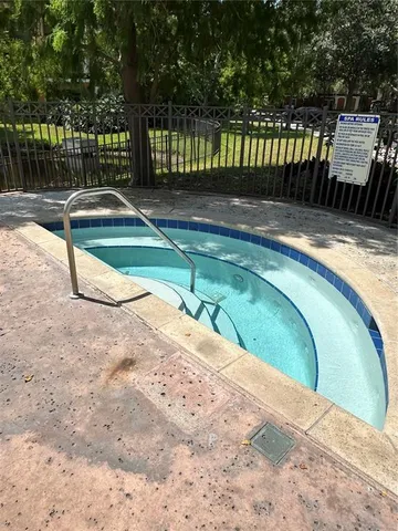 a view of a backyard with sitting area