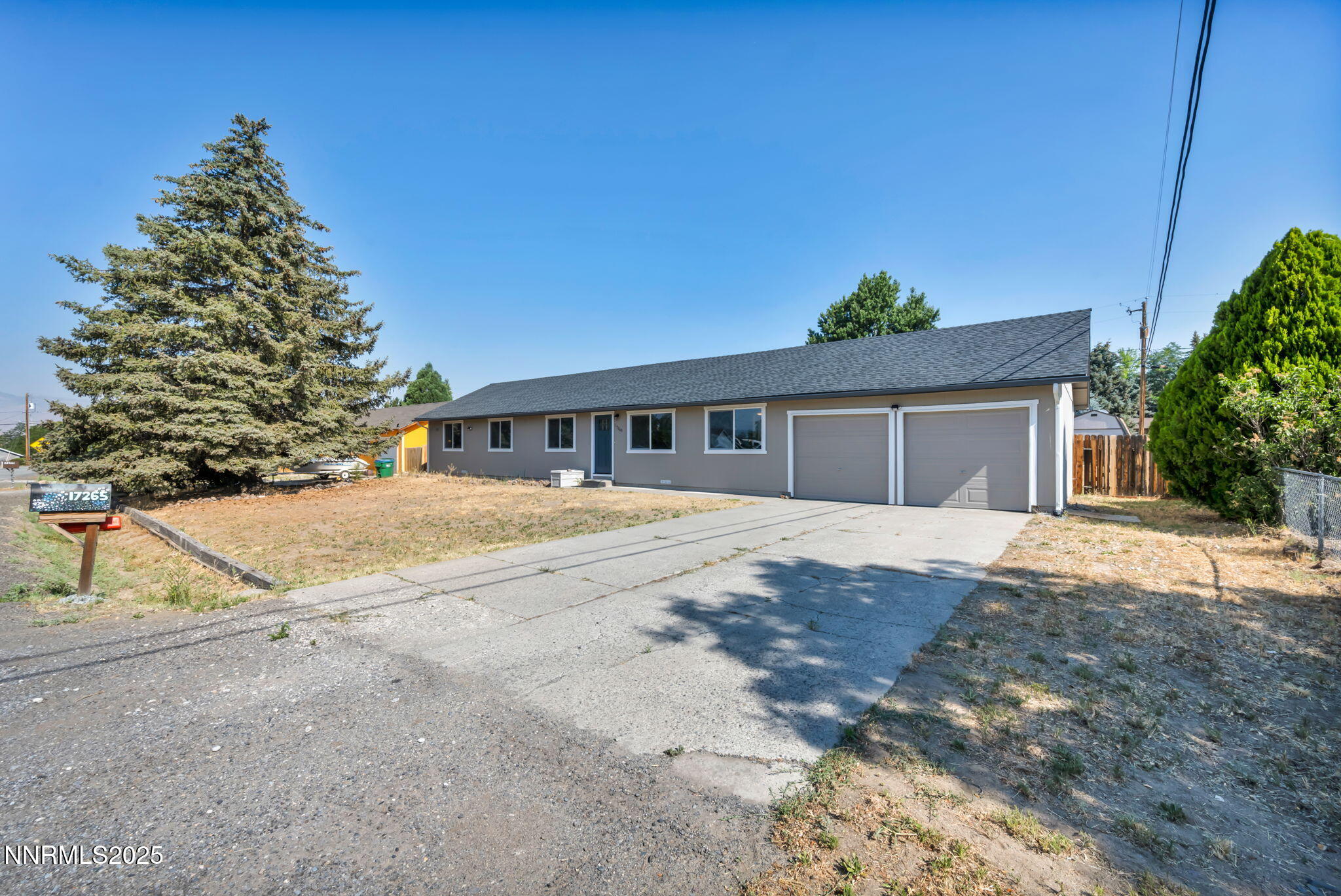 17265 Cold Springs Drive Reno, NV 89508 - Photo 44 of 52 a front view of a house with a yard and garage