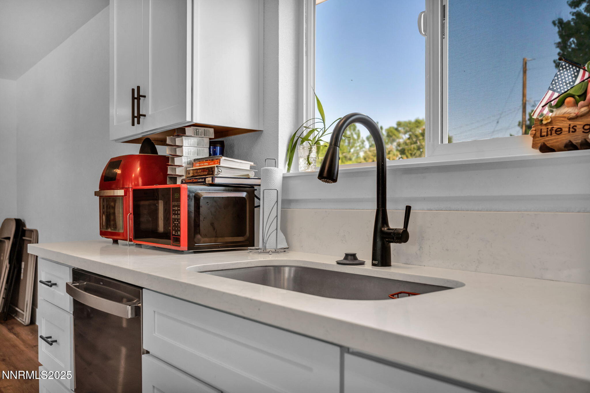 17265 Cold Springs Drive Reno, NV 89508 - Photo 6 of 52 a kitchen with a sink and a stove top oven