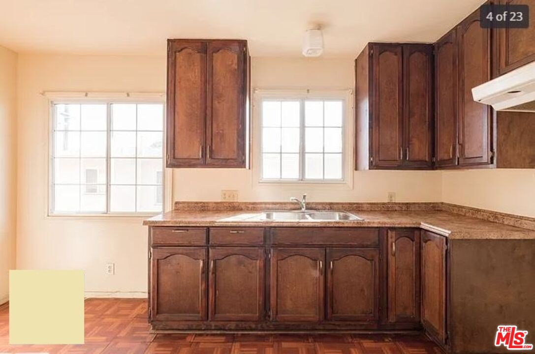 1504 West Beverly Boulevard Montebello, CA 90640 - Photo 13 of 24 a kitchen with granite countertop a sink and a window