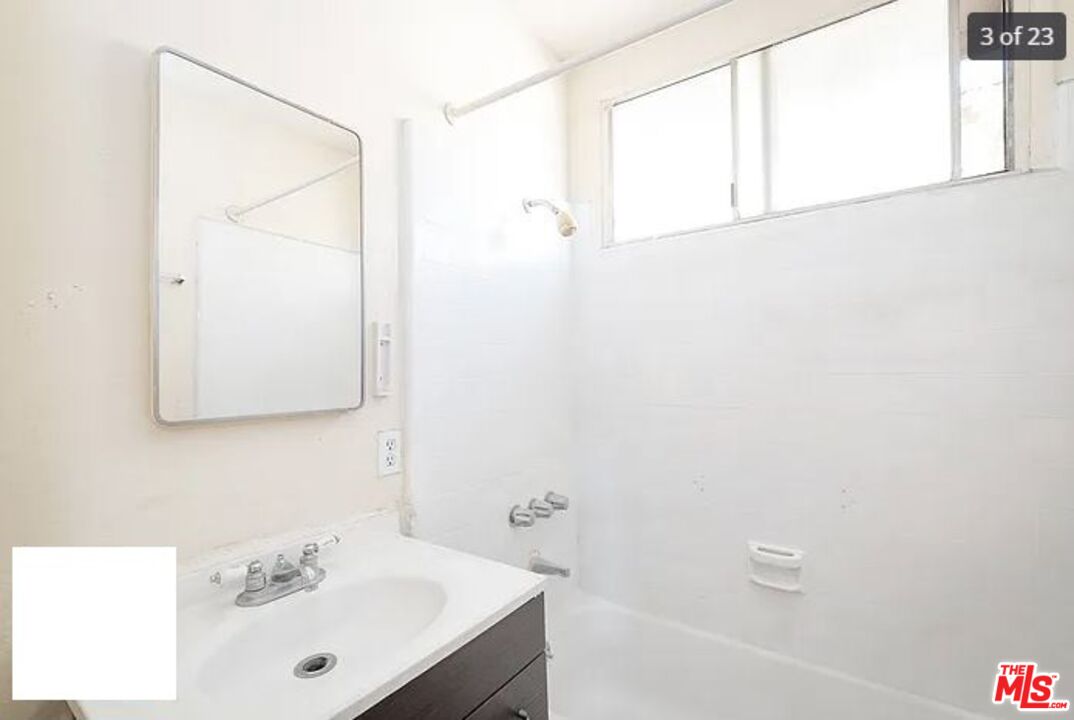1504 West Beverly Boulevard Montebello, CA 90640 - Photo 19 of 24 a bathroom with a sink and a bathtub