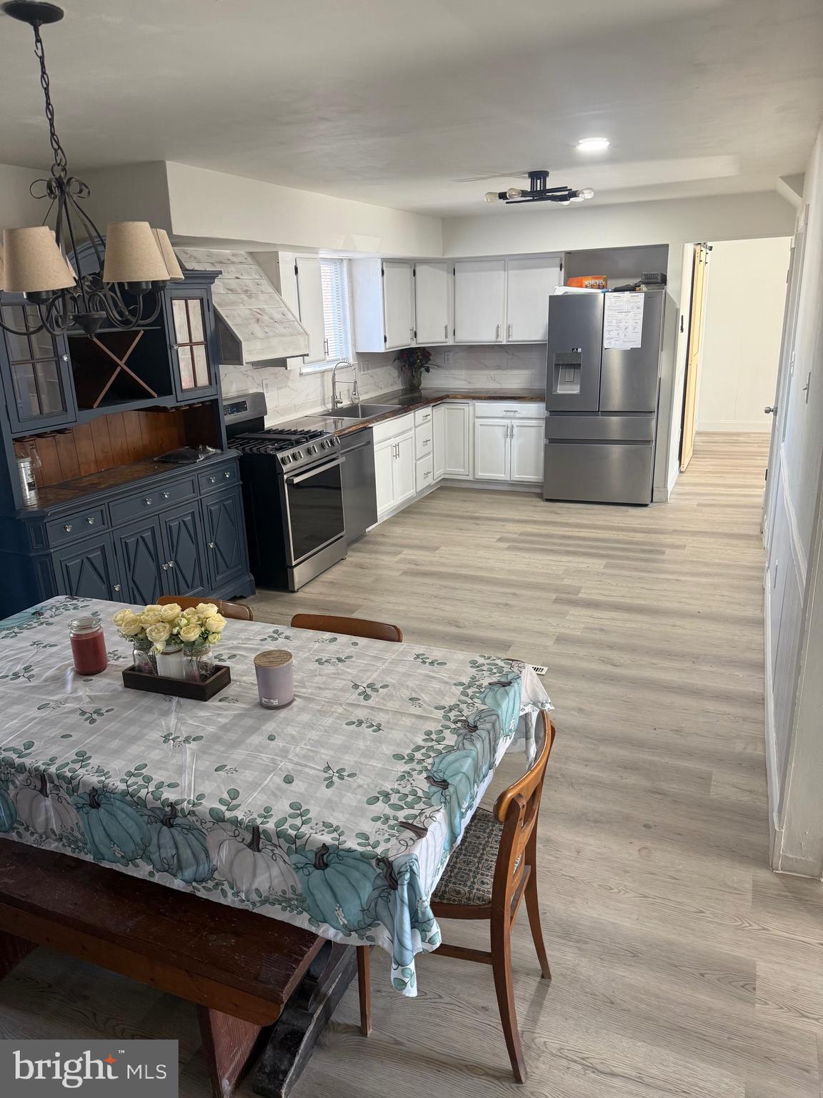 40 Woodlane Drive Blackwood, NJ 08012 - Photo 13 of 30 a kitchen with stainless steel appliances wooden cabinets and wooden floor