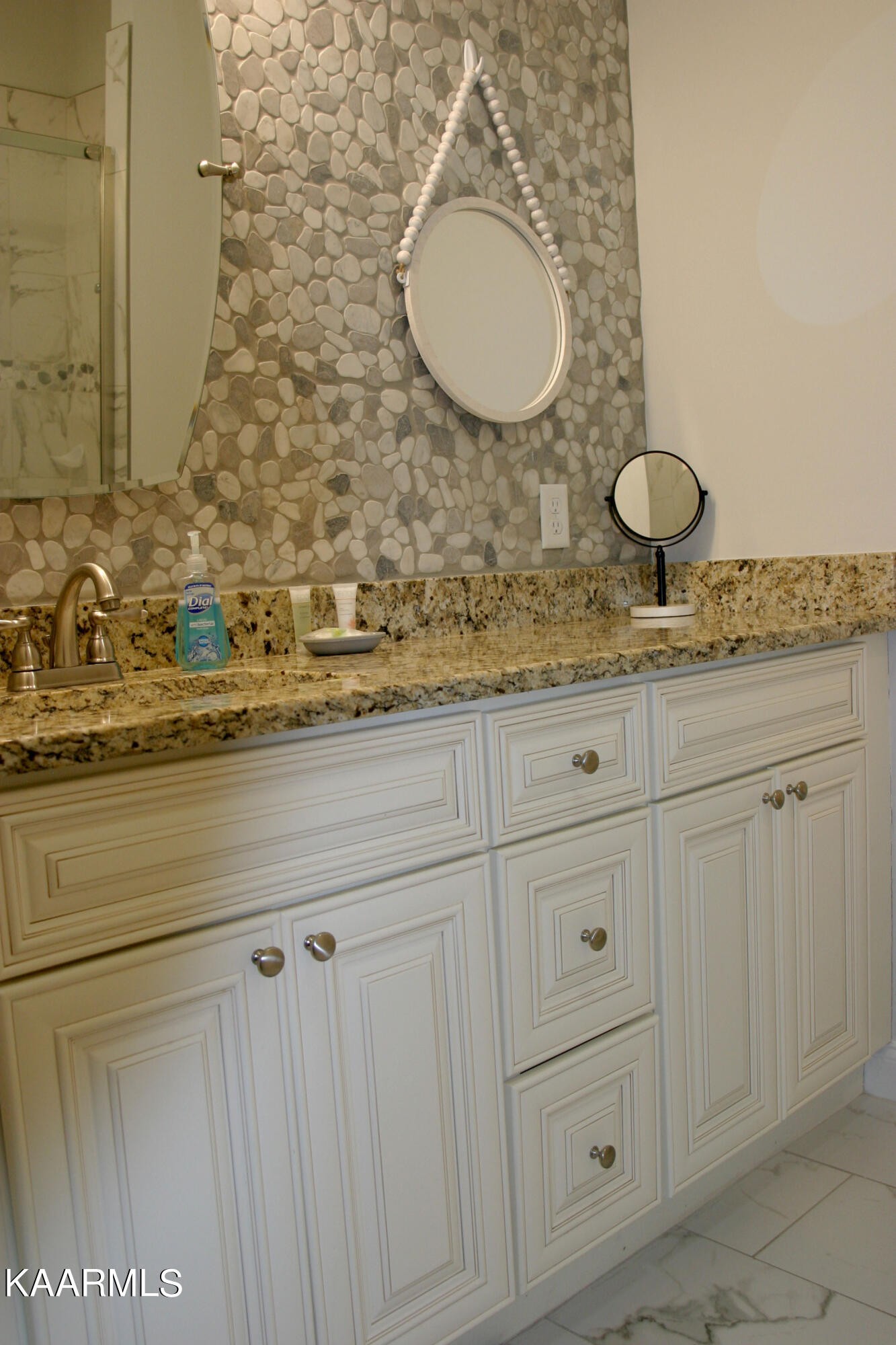 326 Shooting Star Loop, Unit 102 Townsend, TN 37882 - Photo 12 of 22 a bathroom with a granite countertop sink and a mirror