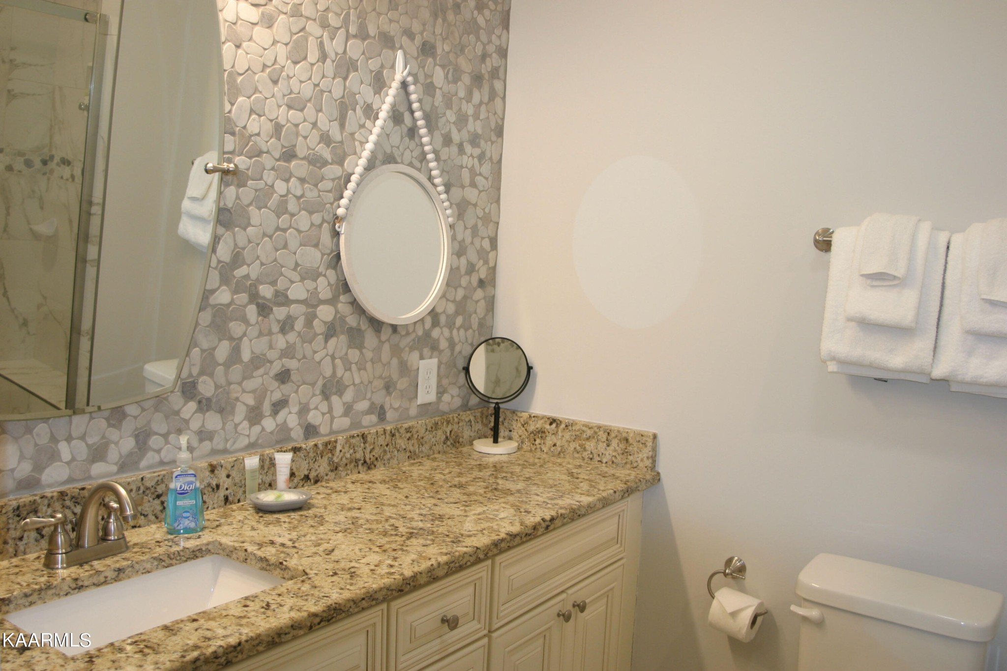 326 Shooting Star Loop, Unit 102 Townsend, TN 37882 - Photo 13 of 22 a bathroom with a granite countertop sink and a mirror