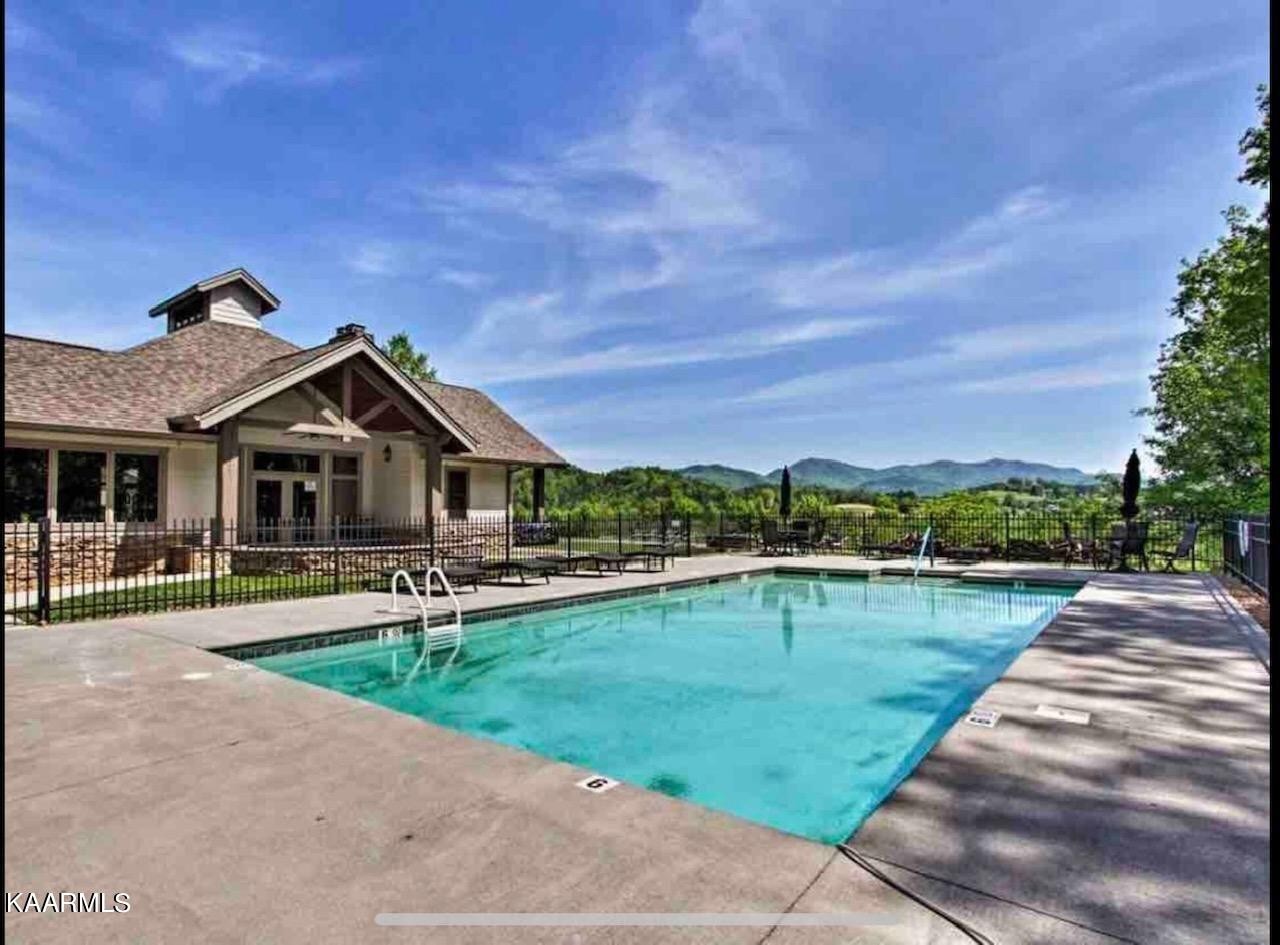 326 Shooting Star Loop, Unit 102 Townsend, TN 37882 - Photo 17 of 22 a aerial view of a house with swimming pool and a yard