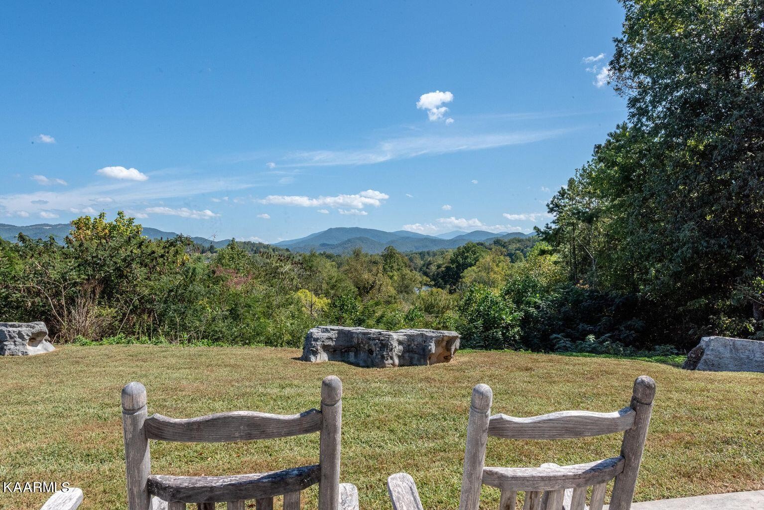 326 Shooting Star Loop, Unit 102 Townsend, TN 37882 - Photo 18 of 22 a view of an chairs and table in the patio