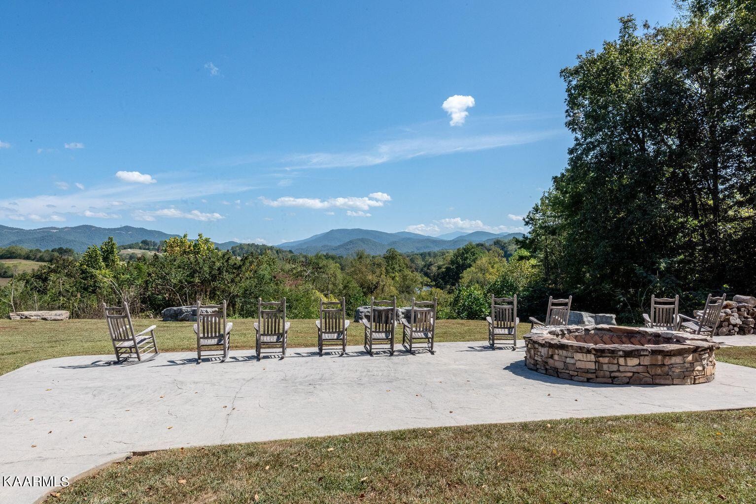 326 Shooting Star Loop, Unit 102 Townsend, TN 37882 - Photo 19 of 22 a view of a swimming pool with a patio and mountain view