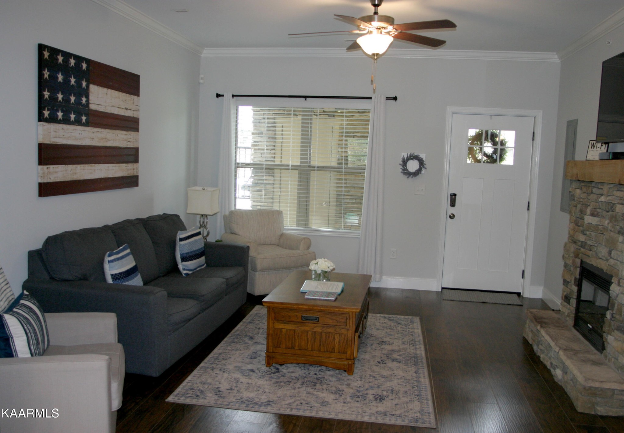 326 Shooting Star Loop, Unit 102 Townsend, TN 37882 - Photo 3 of 22 a living room with furniture and a fireplace