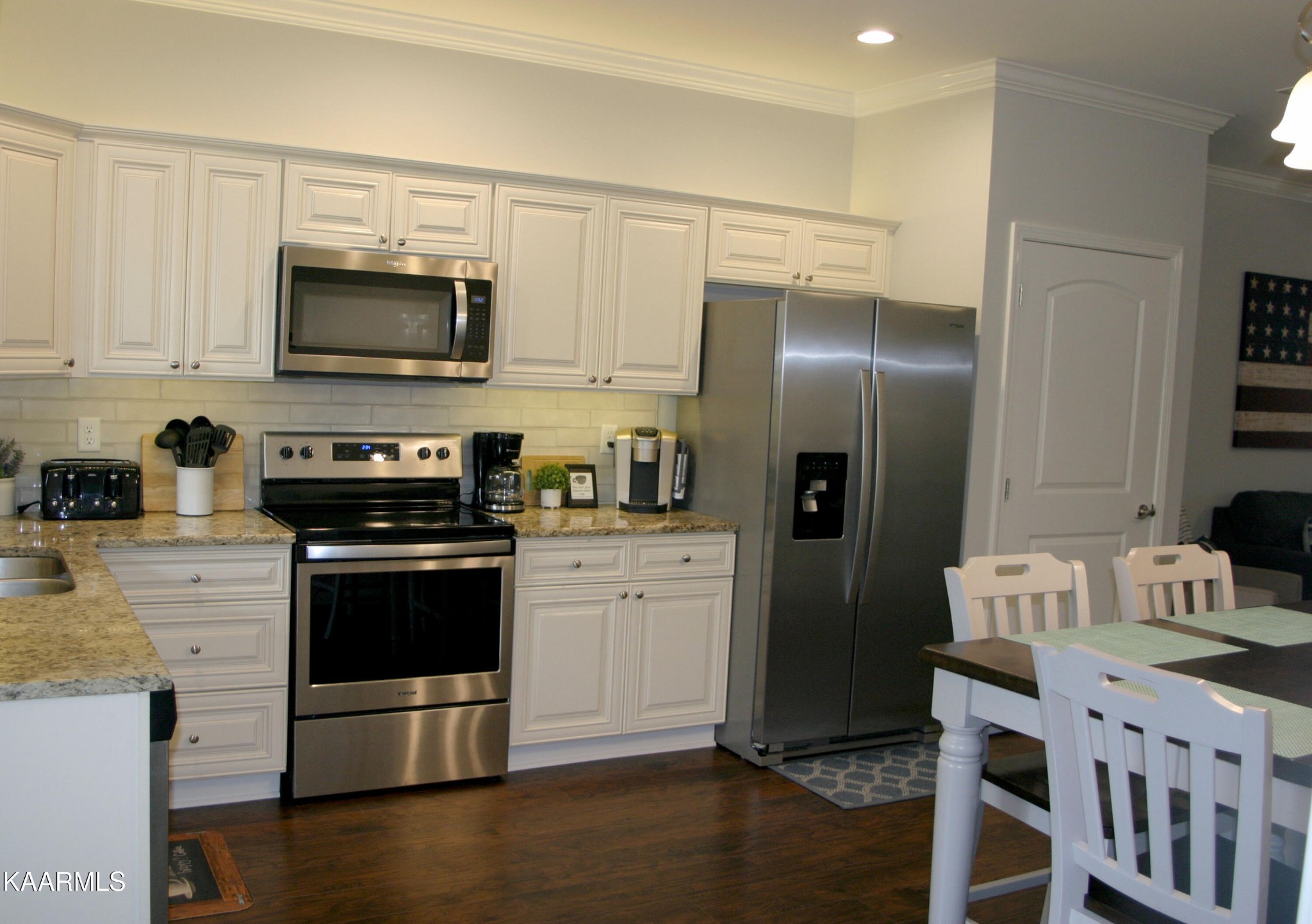 326 Shooting Star Loop, Unit 102 Townsend, TN 37882 - Photo 7 of 22 a kitchen with a refrigerator stove and microwave