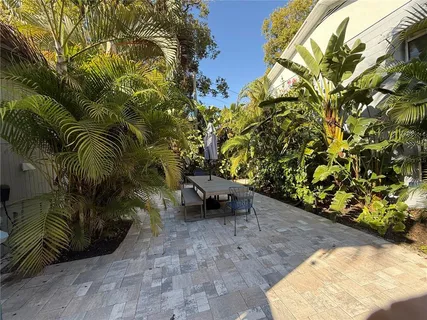 a backyard of a house with lots of green space
