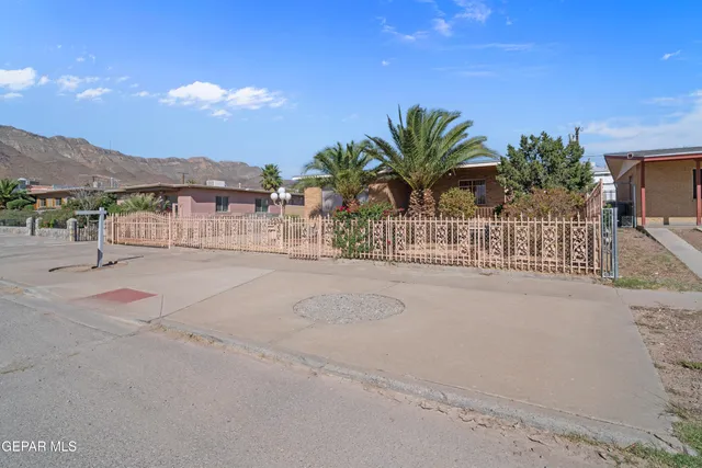 a view of a backyard with sitting area