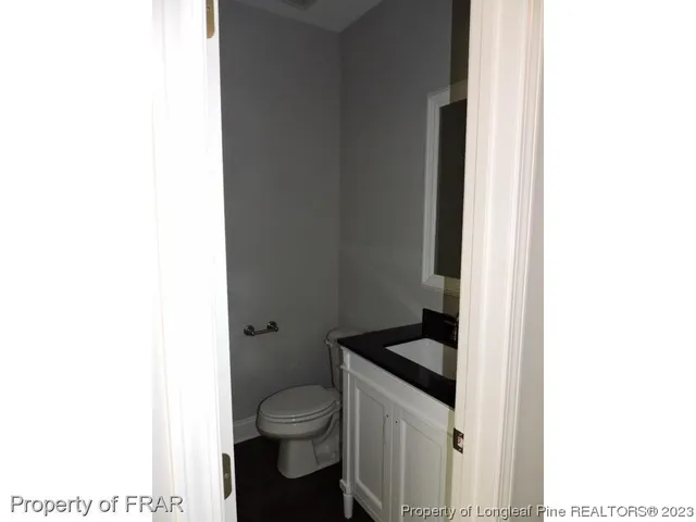 a bathroom with a toilet and a sink