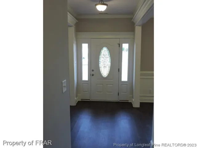 a view of a livingroom with wooden floor