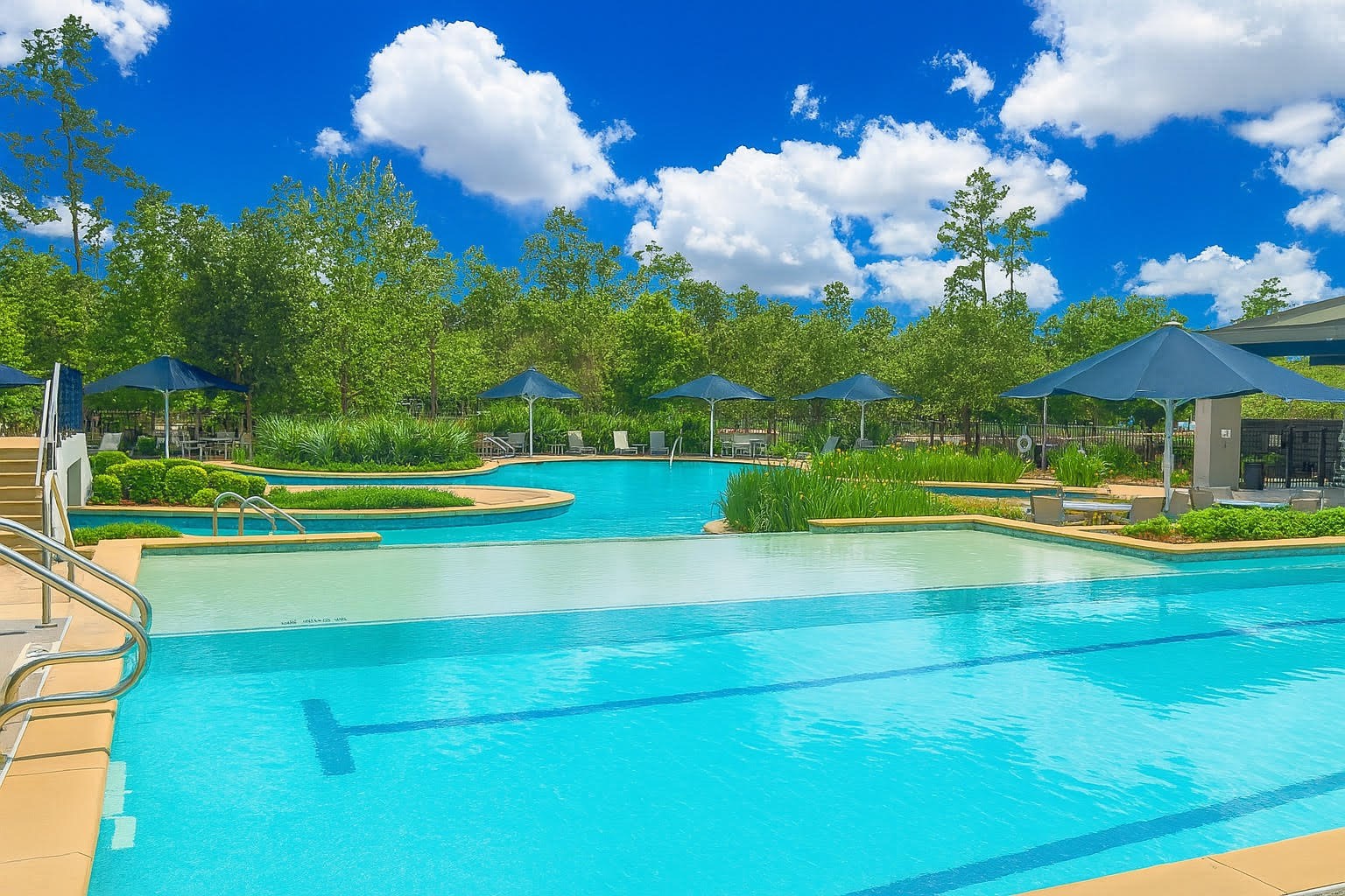 27720 Hazelbrook Lane Spring, TX 77386 - Photo 43 of 48 The Woodson's Reserve Clubhouse is connected to a resort-style community pool with a lazy river, lap pool, and splash pad. An additional Splash Pad can be found in a nearby section.