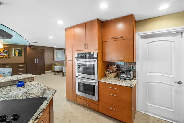 a kitchen with a refrigerator and a sink