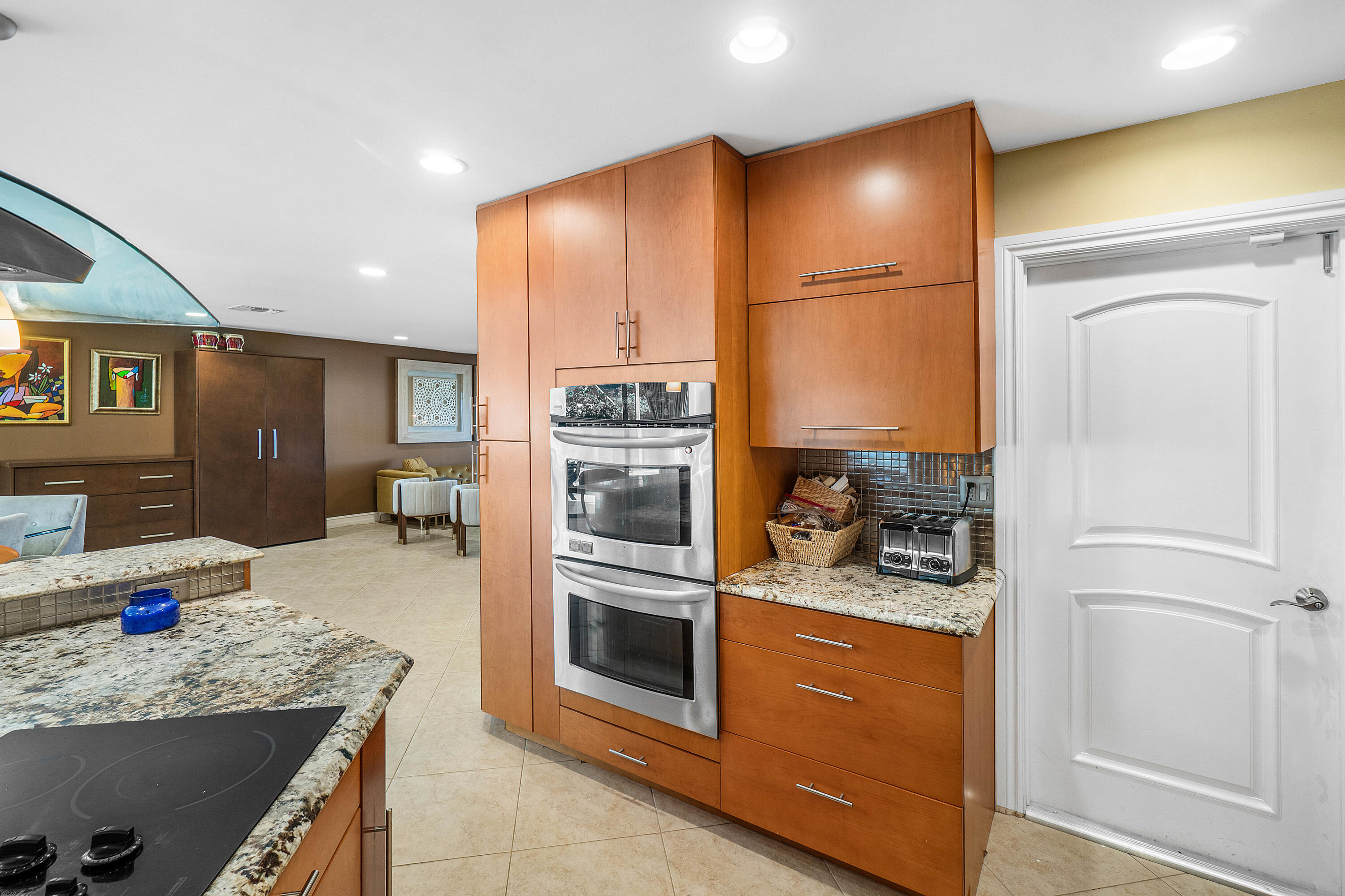 3509 Northwest 26th Court Boca Raton, FL 33434 - Photo 14 of 33 a kitchen with a refrigerator and a sink