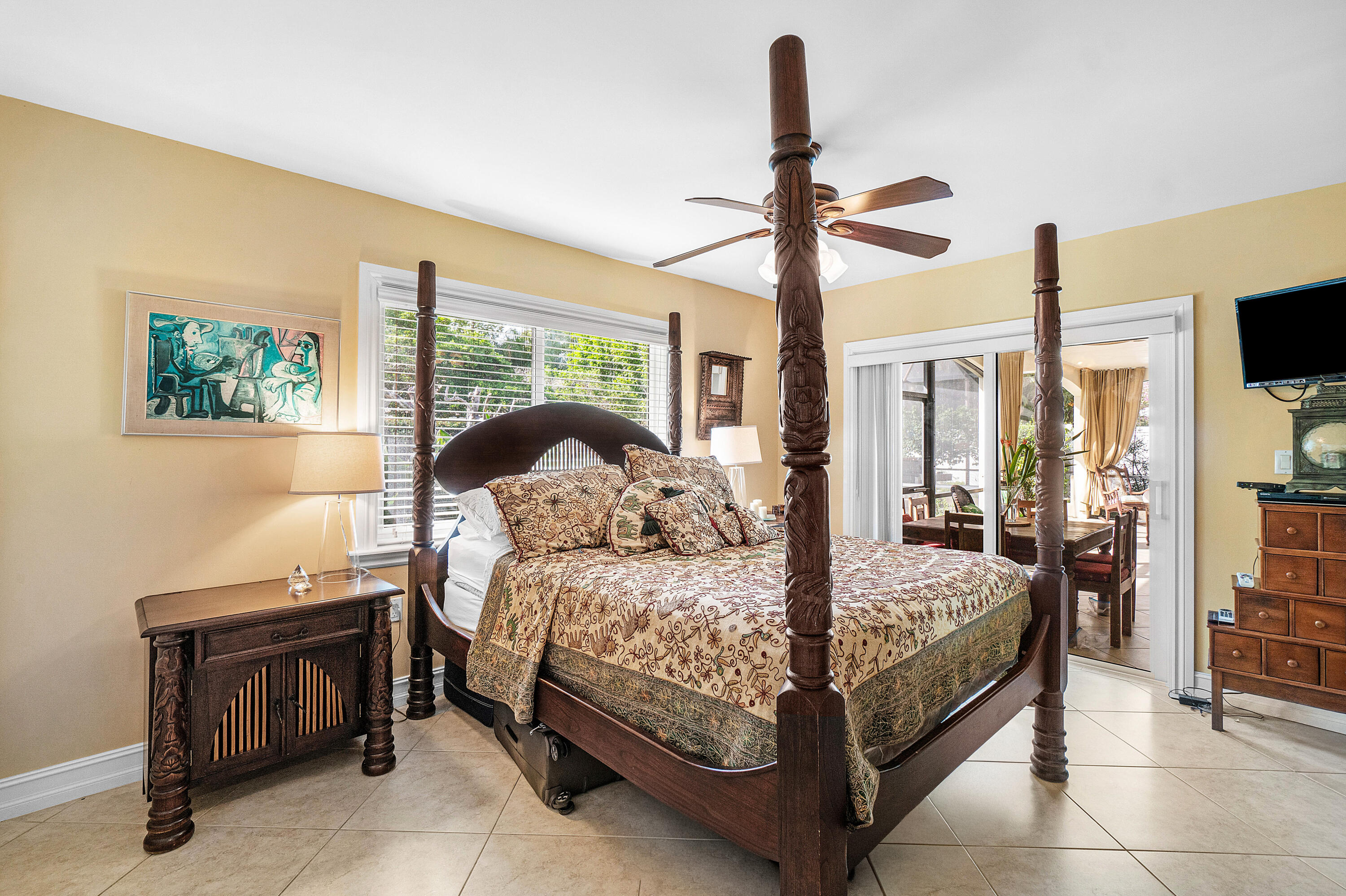 3509 Northwest 26th Court Boca Raton, FL 33434 - Photo 17 of 33 a bedroom with a bed and a chandelier