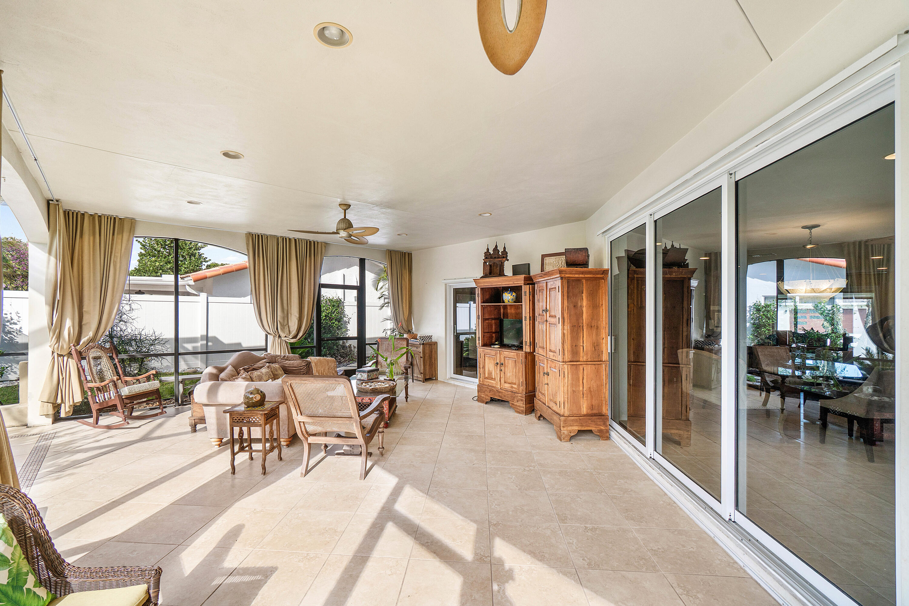 3509 Northwest 26th Court Boca Raton, FL 33434 - Photo 25 of 33 a living room with furniture a view of dining room and wooden floor