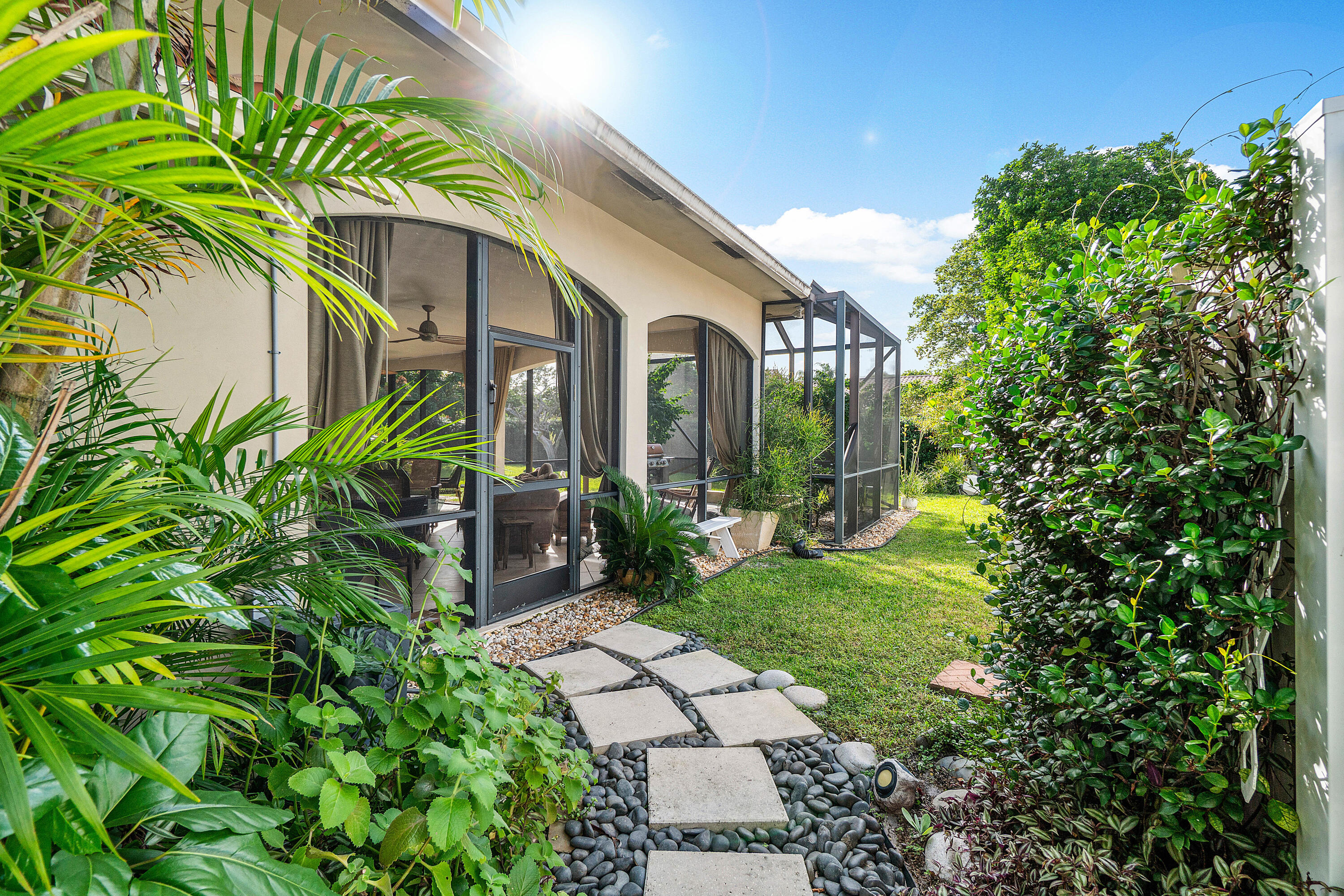 3509 Northwest 26th Court Boca Raton, FL 33434 - Photo 28 of 33 a front view of a house with a yard