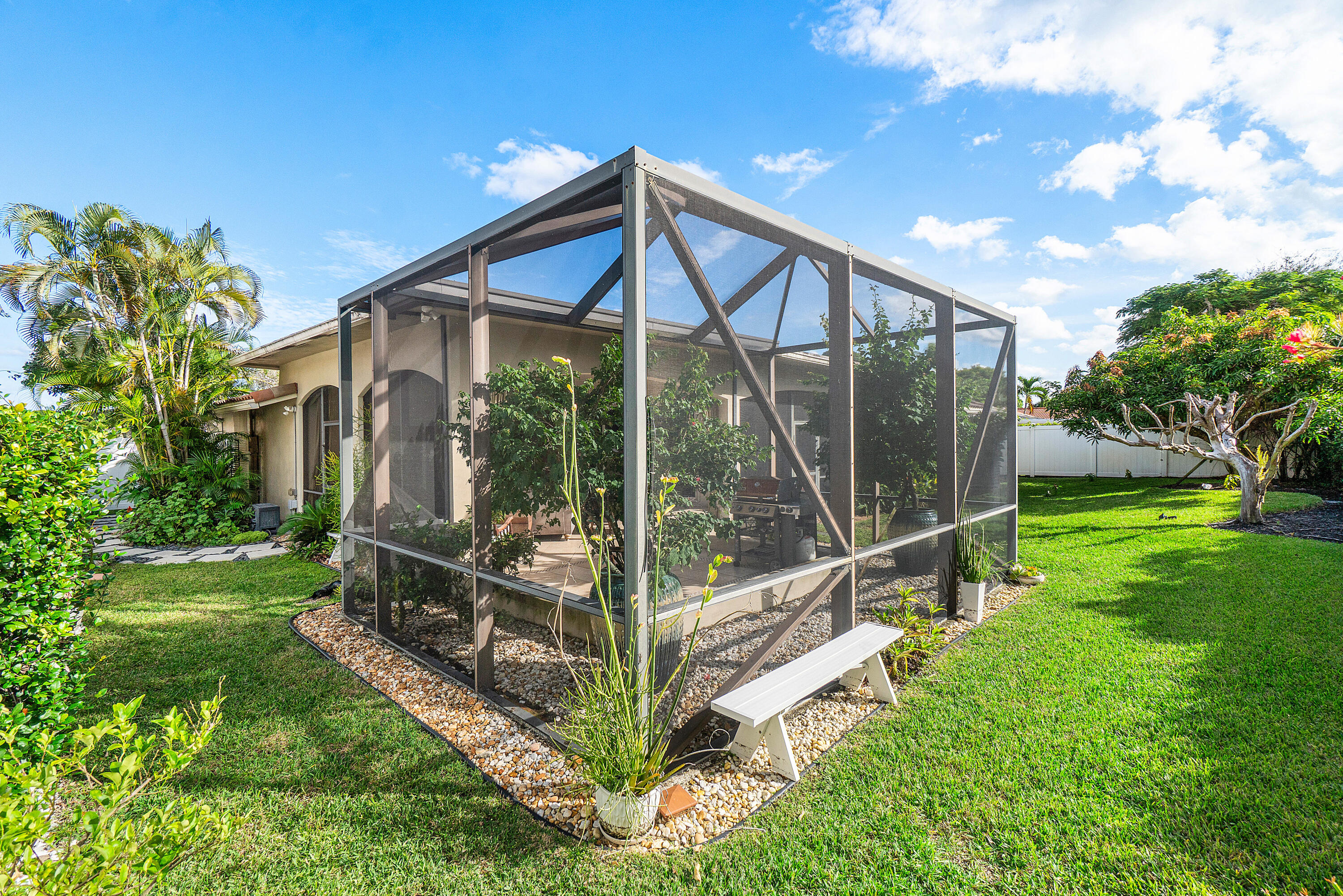 3509 Northwest 26th Court Boca Raton, FL 33434 - Photo 30 of 33 a view of a house with backyard and porch