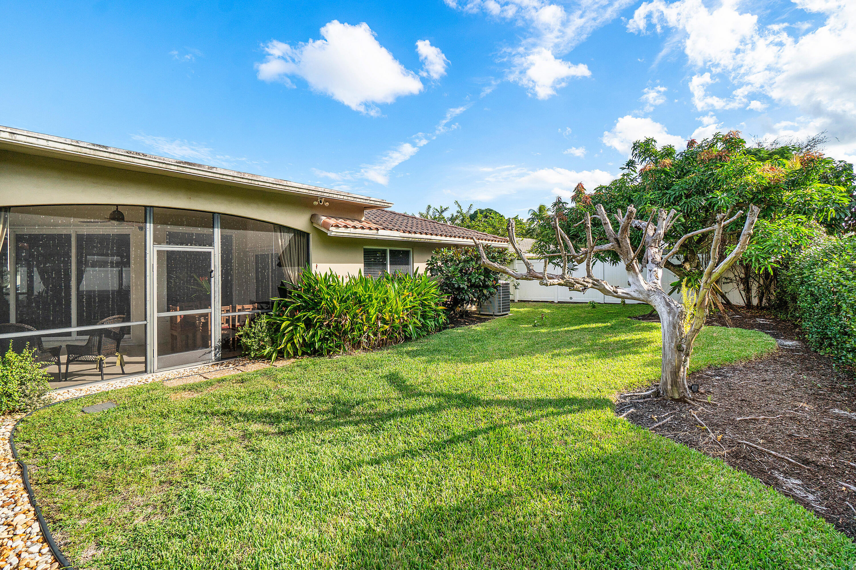 3509 Northwest 26th Court Boca Raton, FL 33434 - Photo 33 of 33 a house view with a garden space