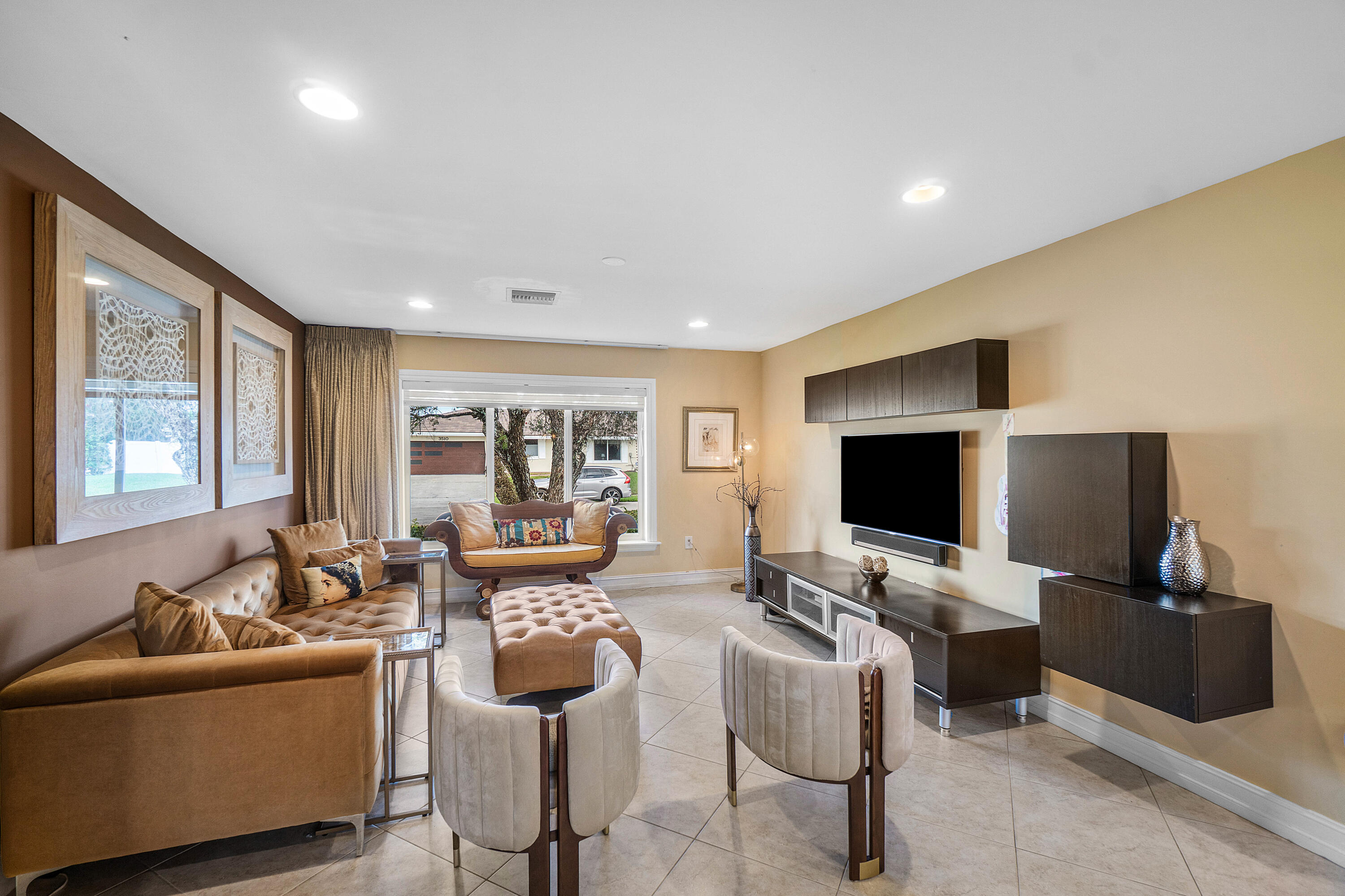 3509 Northwest 26th Court Boca Raton, FL 33434 - Photo 6 of 33 a living room with furniture and a flat screen tv