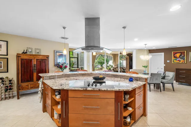 a kitchen with stainless steel appliances granite countertop a stove and a refrigerator