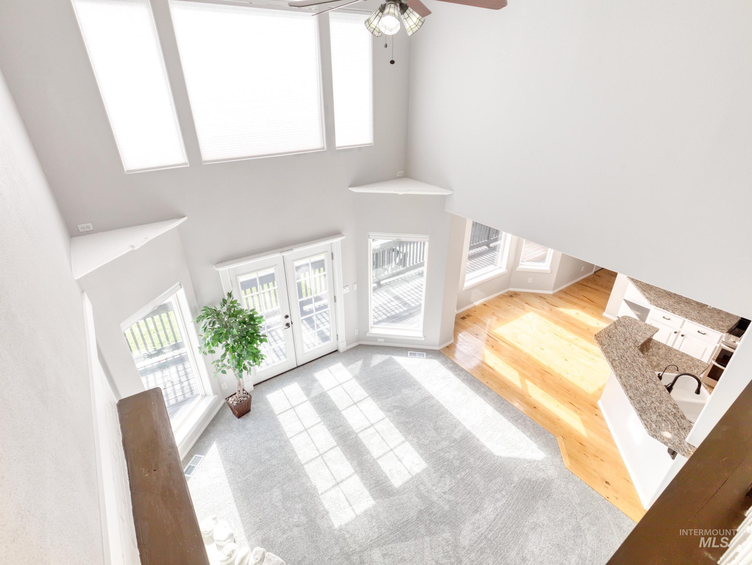 16277 Sand Hollow Road Caldwell, ID 83607 - Photo 23 of 39 Entrance foyer with a high ceiling, light wood finished floors, french doors, and ceiling fan