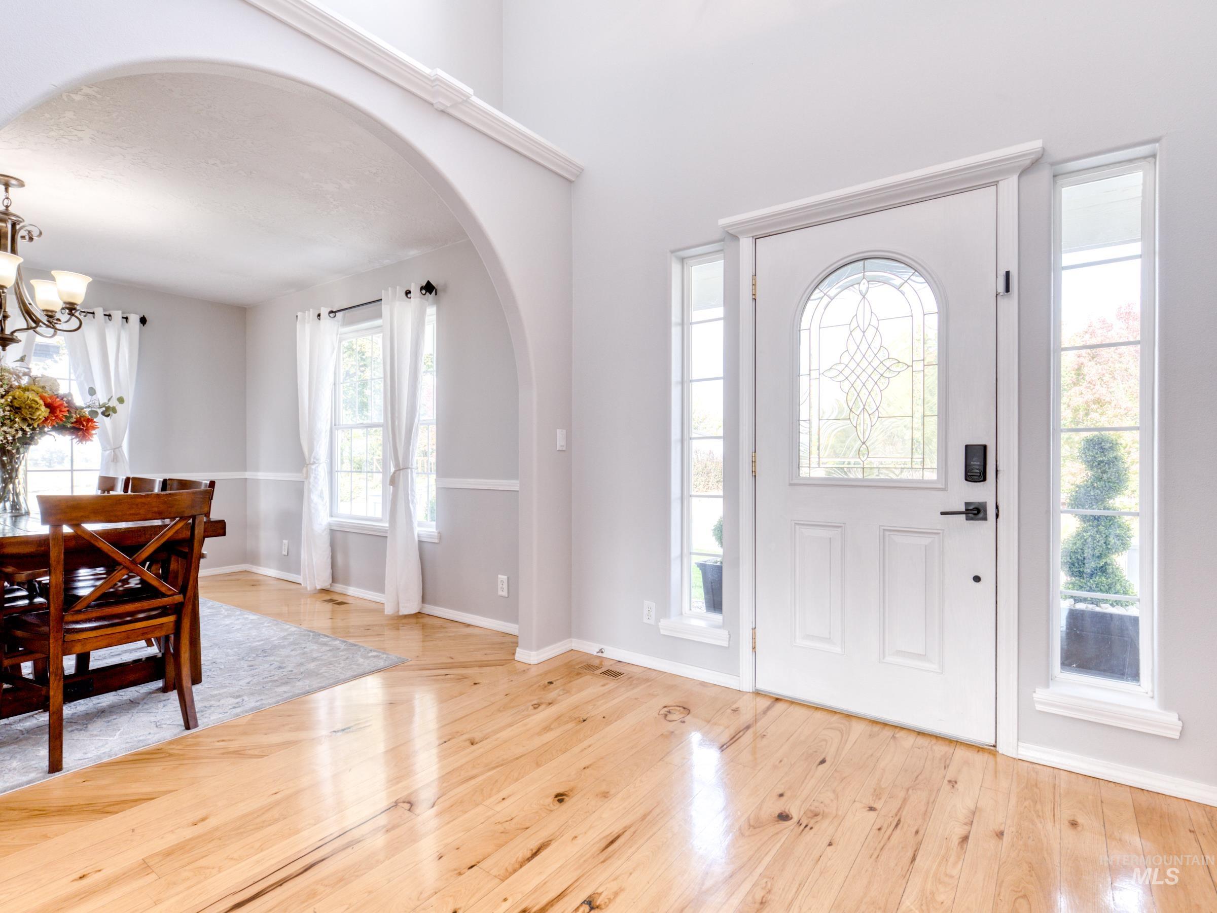 16277 Sand Hollow Road Caldwell, ID 83607 - Photo 10 of 39 Entrance foyer featuring arched walkways, plenty of natural light, and light wood-type flooring