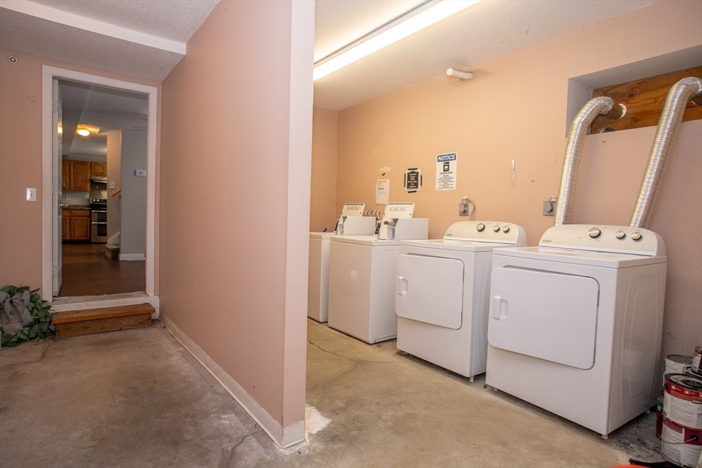35 Cedar Street, Unit 2 Gardner, MA 01440 - Photo 18 of 32 a room with dryer and washer