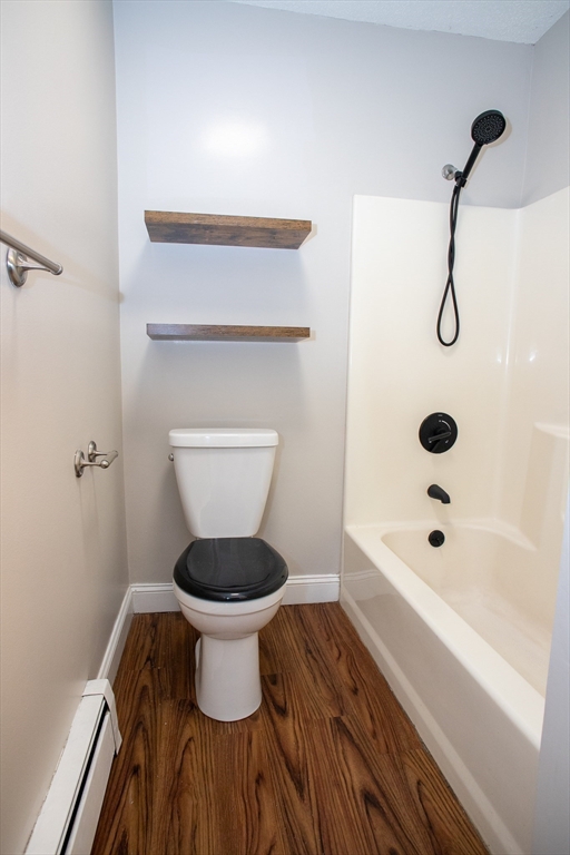 35 Cedar Street, Unit 2 Gardner, MA 01440 - Photo 26 of 32 a bathroom with a toilet and a shower
