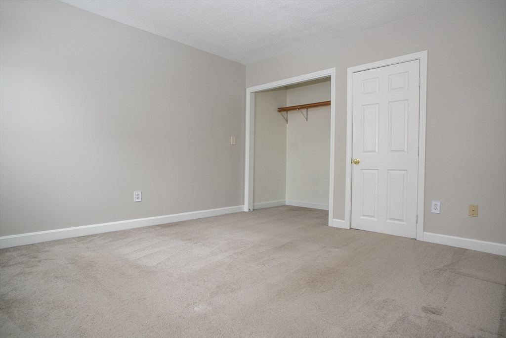 35 Cedar Street, Unit 2 Gardner, MA 01440 - Photo 27 of 32 an empty room with closet area