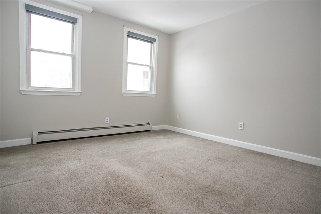 35 Cedar Street, Unit 2 Gardner, MA 01440 - Photo 28 of 32 an empty room with a window