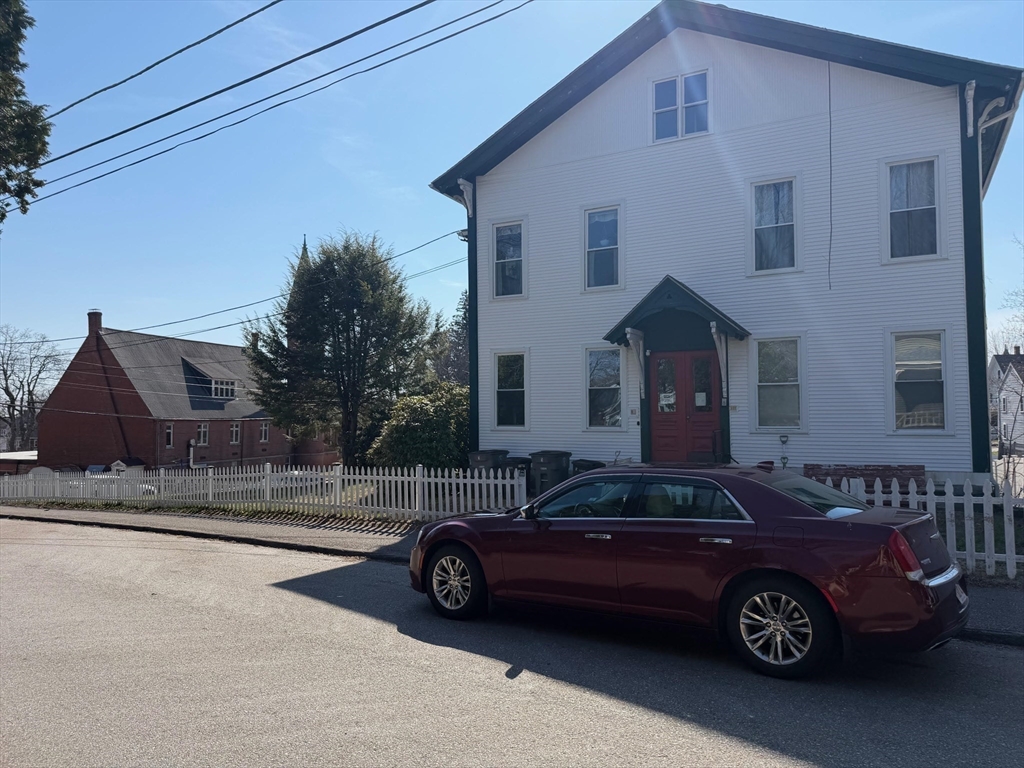 35 Cedar Street, Unit 2 Gardner, MA 01440 - Photo 31 of 32 a car parked in front of a house